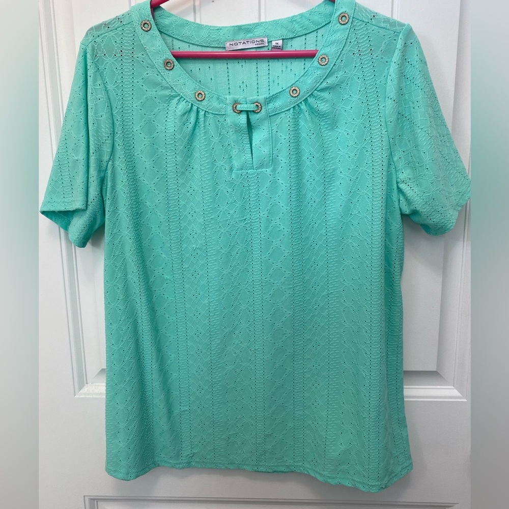 Notations teal scoop neck top. Size 1X. Eyelet detail. Circle rhinestone detail